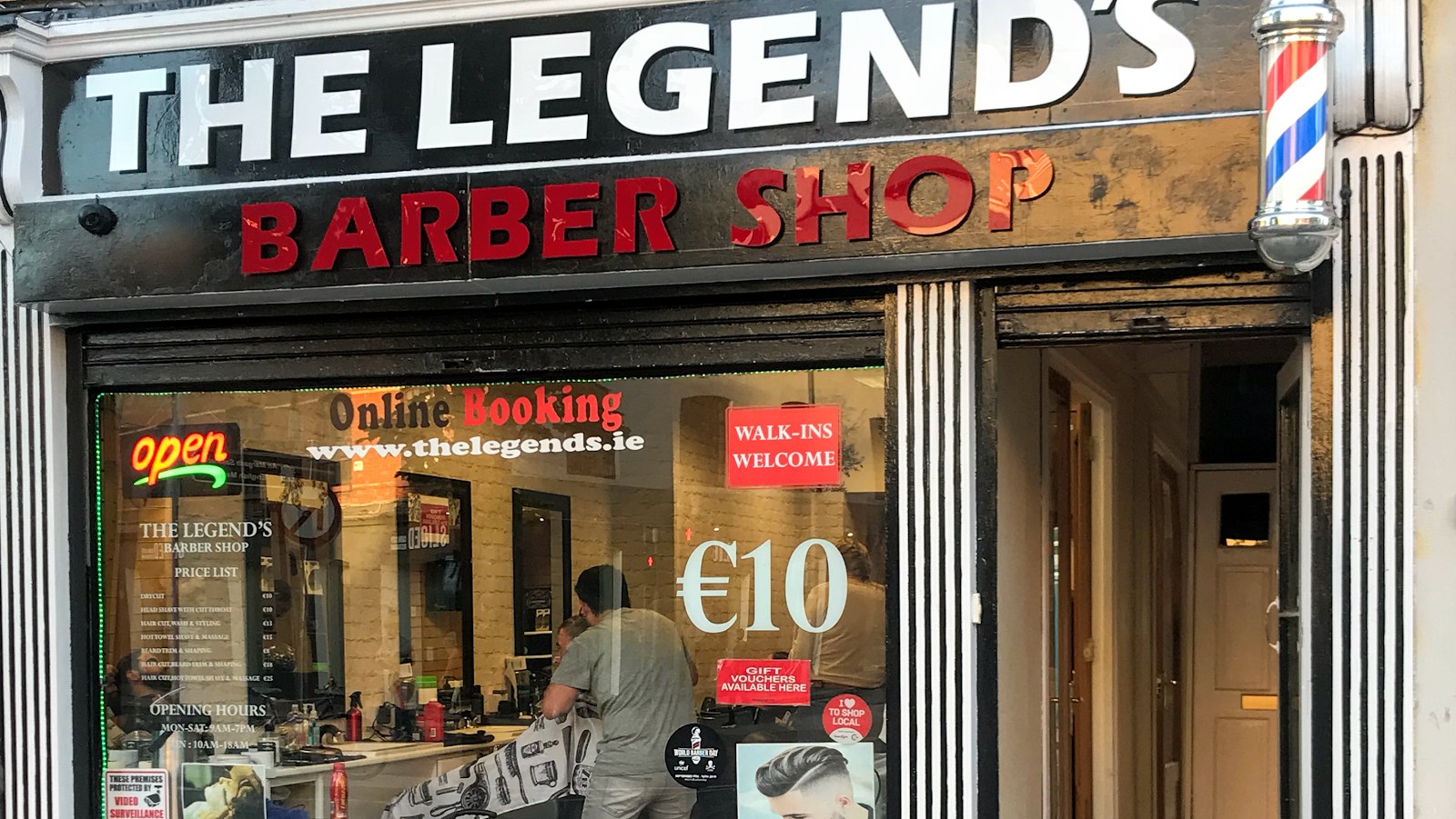 The Legend’s Barber Shop shopfront at 27 Parnell Place, Cork, with the barber pole and walk-ins sign